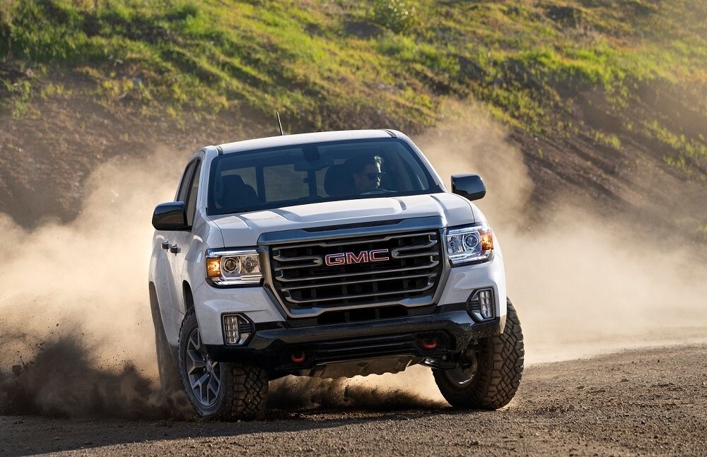 GMC truck driving in the dirt